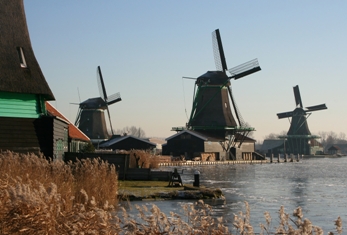 This photo of windmills at the Zaanse Schans in Holland (Netherlands) was taken by Amsterdam photographer Herman Brinkman.